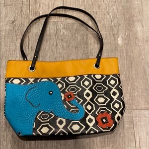 Relic leather purse with elephant accent